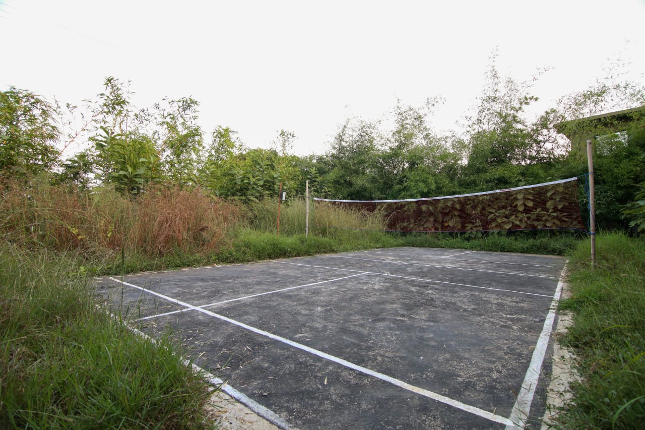 Badminton court at the edge of the grounds